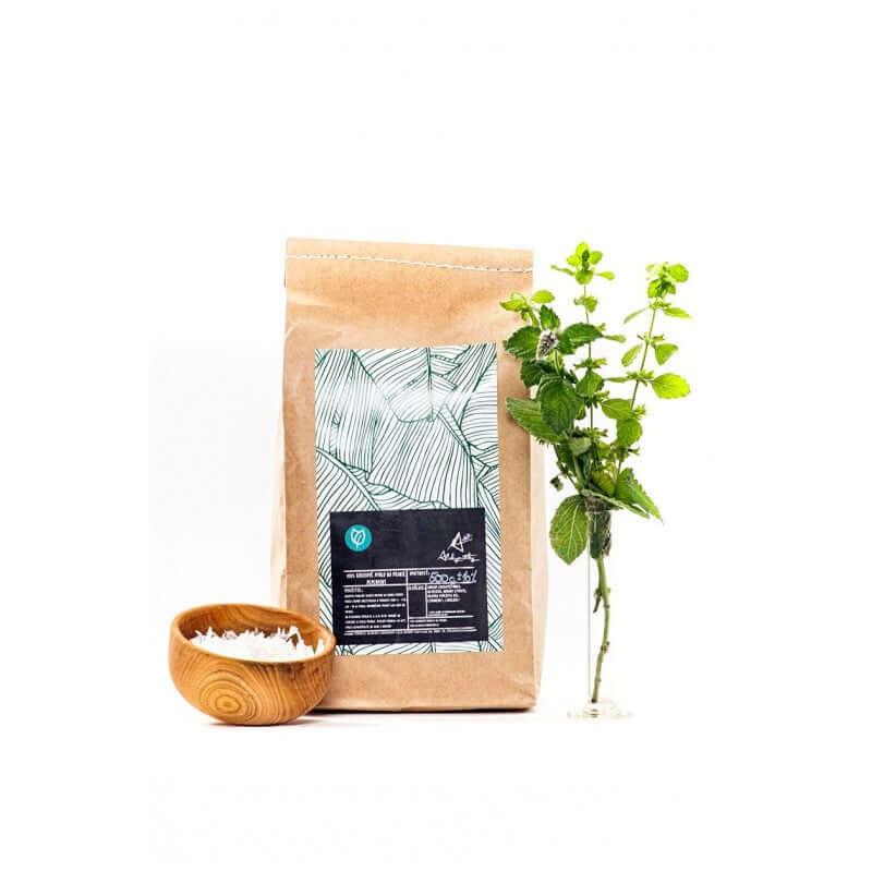 Alchymistky mýdlové vločky máta v ekologickém balení s mátou a dřevěnou miskou na praní prádla.