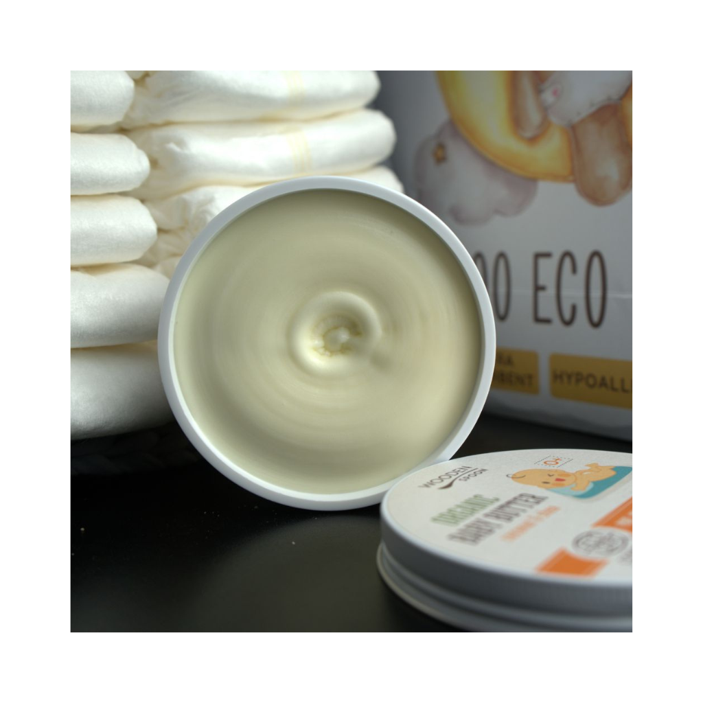 Dětské tělové máslo Wooden Spoon s kokosem a máslem shea, bez parfemací pro citlivou pokožku miminek.