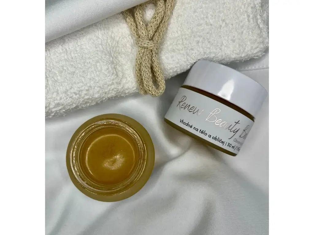 Obnovující balzám Jsi Renew Beauty Balm, ideální pro suchou a citlivou pleť, v elegantním balení na bílém pozadí.